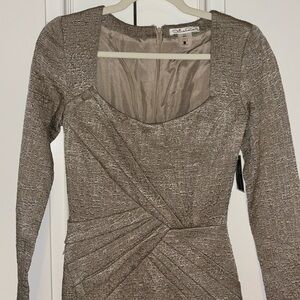 Tan quarter sleeve mid length dress.